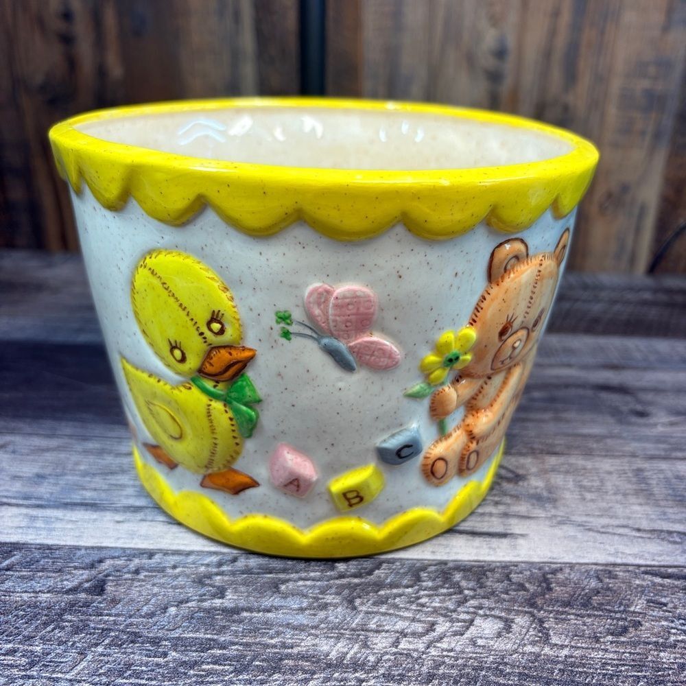 Yellow and White Ceramic Planter with Duck and Bear Design